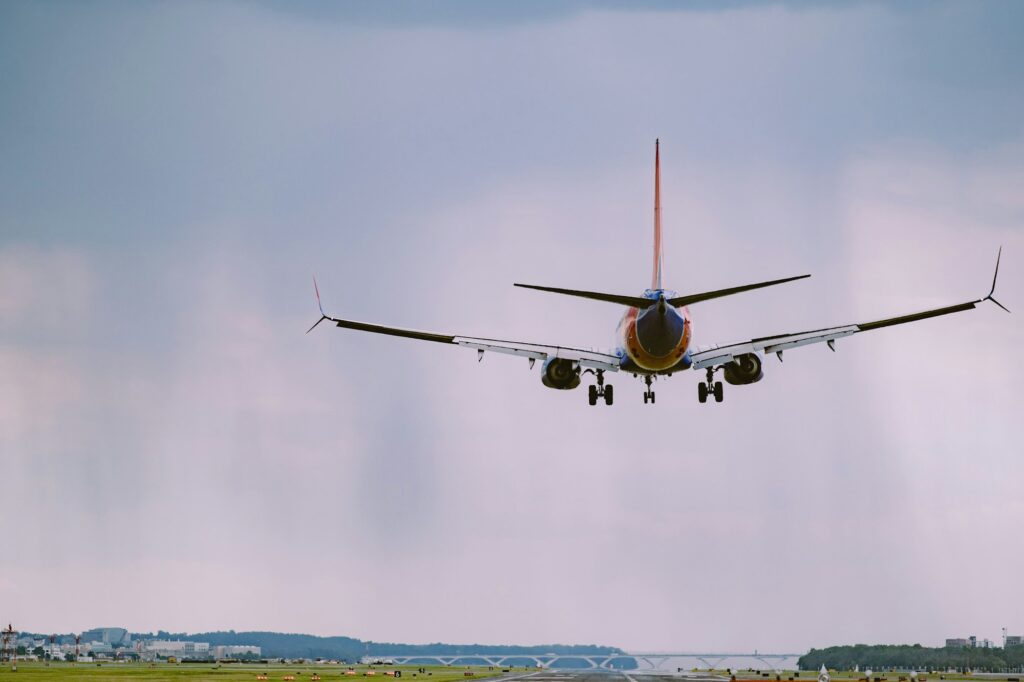 Airplane in flight in a cloudy sky