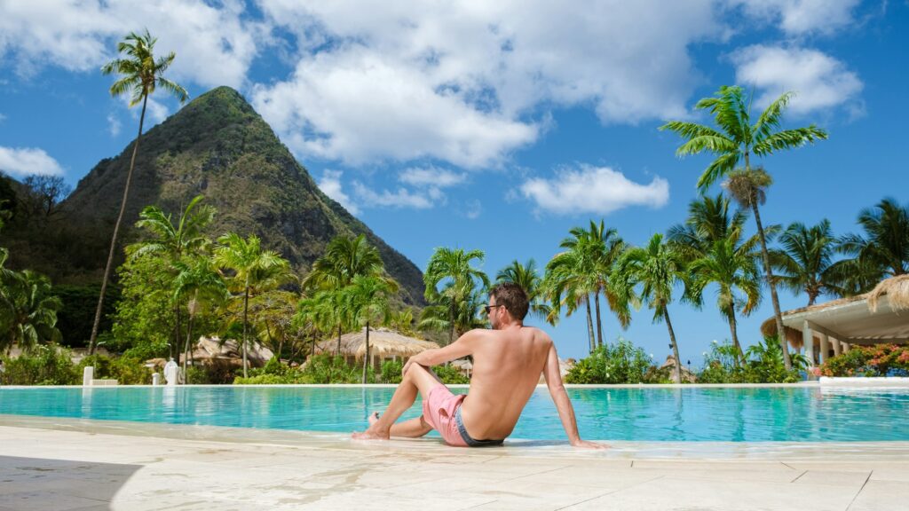 Sugar beach Saint Lucia ,white tropical beach palm trees and luxury beach chairs St Lucia Caribbean